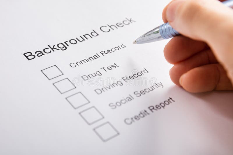 Person Hand Filling Background Check Form royalty free stock photography