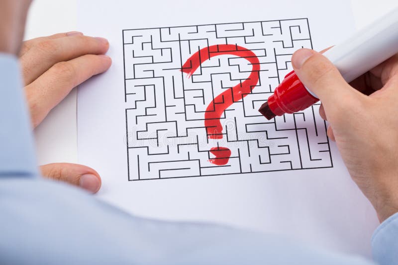 Person Hand With Question Mark On Maze royalty free stock images