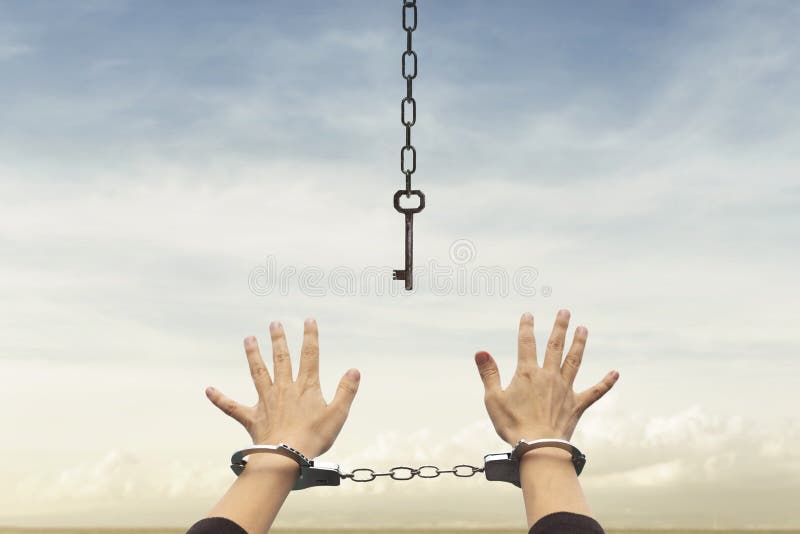 Person with handcuffed hands tries to take the keys to free themselves but they are too far away