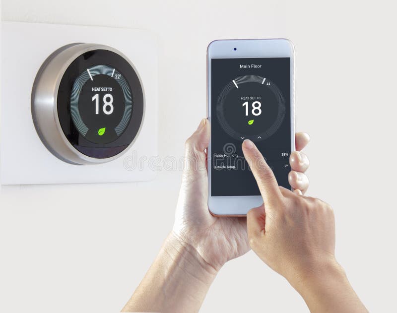 Smart Thermostat with a person saving energy with a smart device on a white background stock photography