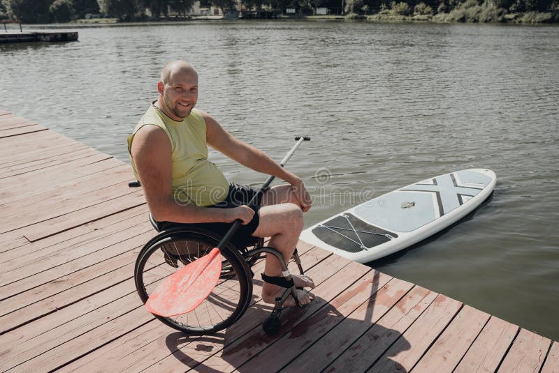 Person with a Physical Disability in a Wheelchair Will Be Ride on Sup