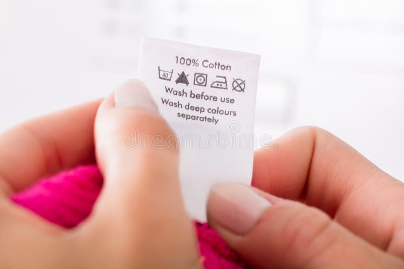 Person Reading The Clothing Label
