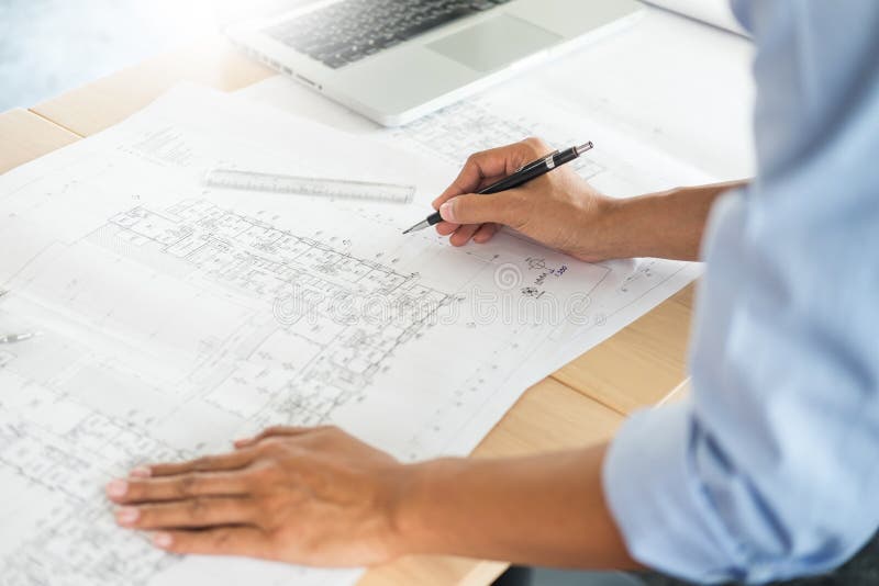 Person`s Engineer Hand Drawing Plan on Blue Print with Architect Stock