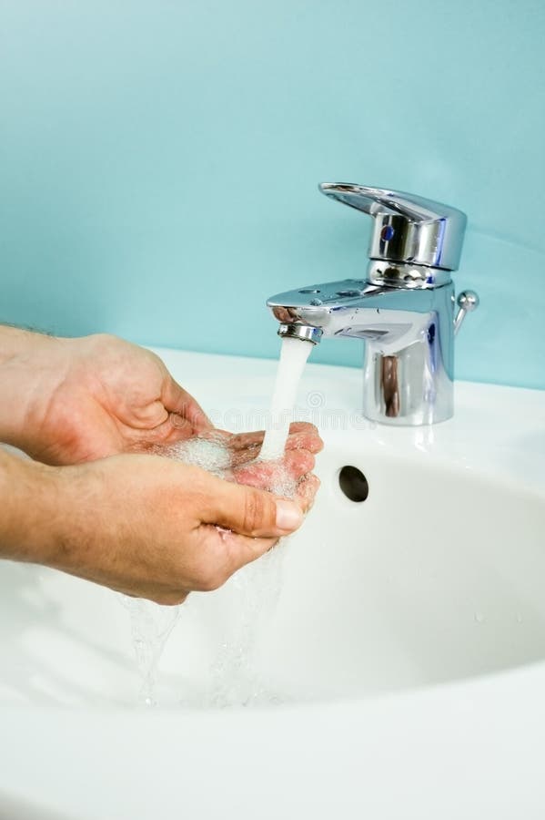 Person s hands washing under tap