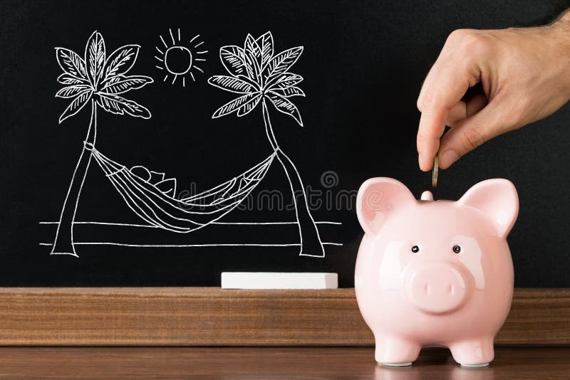 Person Saving Money In Piggybank för semester arkivbilder Person Saving Money In Piggybank för semester arkivbilder