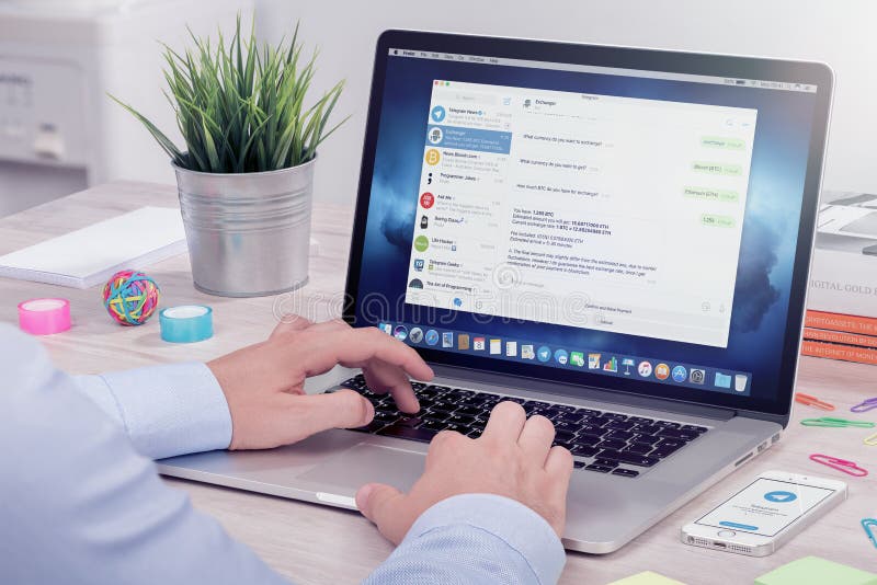 A person sends messages via desktop version of Telegram messenger