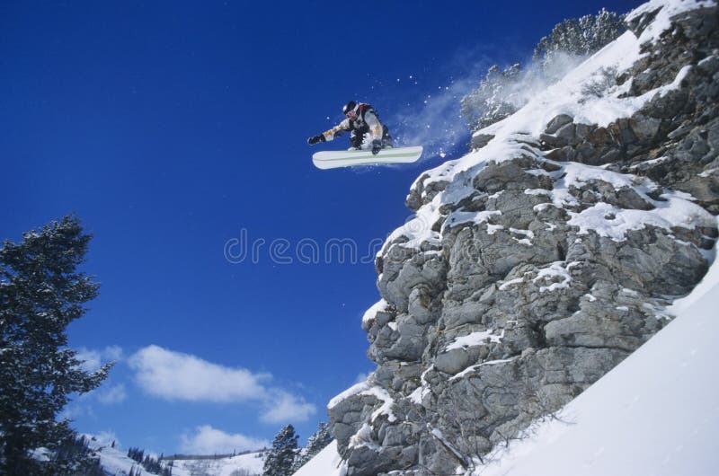 Person On Snowboard Jumping Midair fotos de archivo Person On Snowboard Jumping Midair fotos de archivo