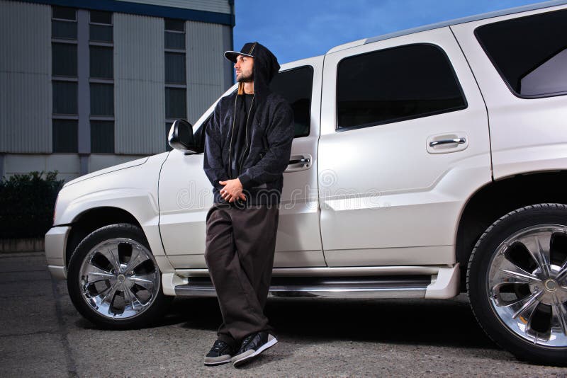 Person standing next to an SUV royalty free stock photo