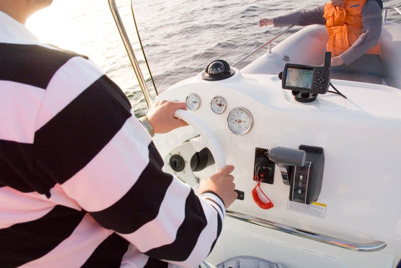 Person steering boat