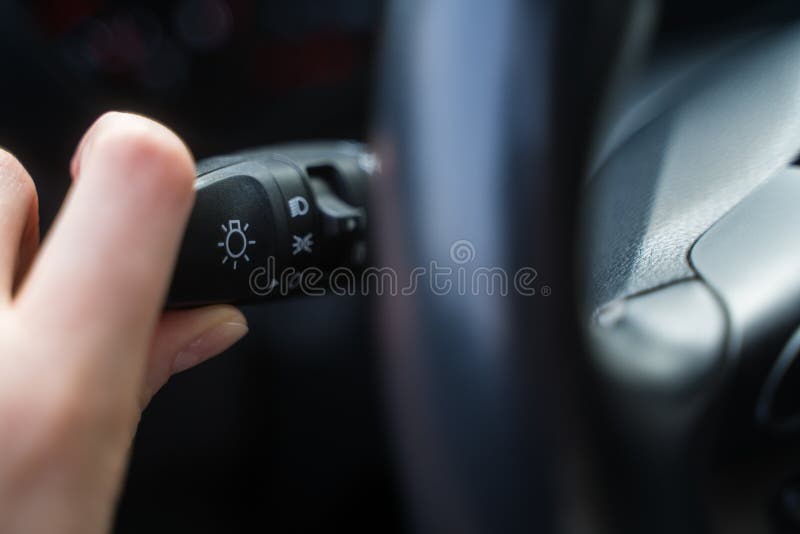 Person Switches To Indicate the Turn in the Car. Control of the Switch in Automobile Stock Photo