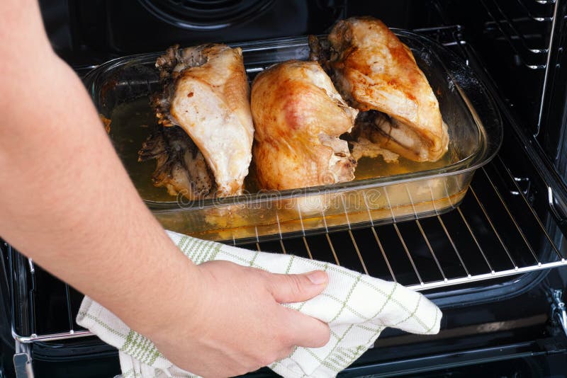 Person Taking Roasted Chicken Breasts Out of Oven Stock Image - Image ...