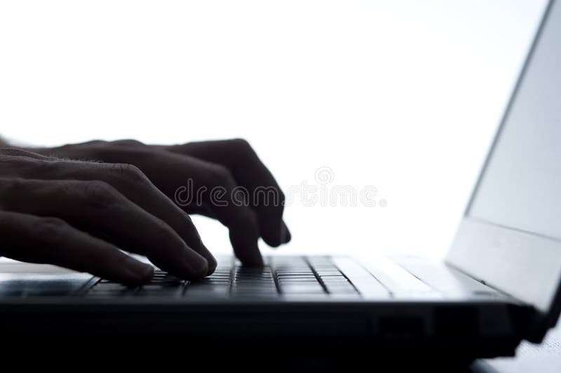 Person typing on a laptop keyboard stock photography Person typing on a laptop keyboard stock photography