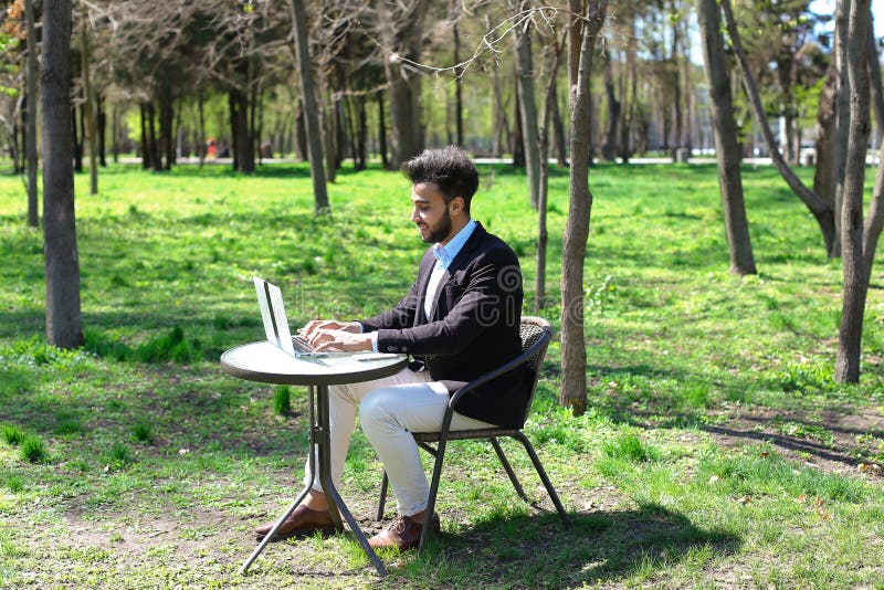 Journalist finished work in park stock image