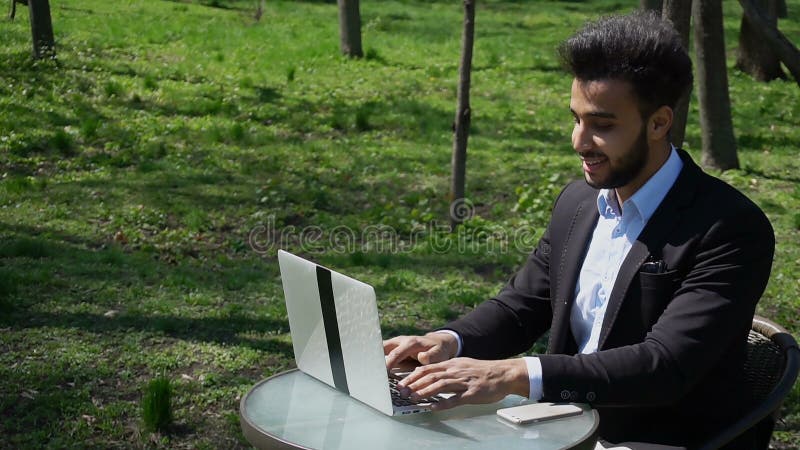 Journalist finished work in park. r royalty free stock image