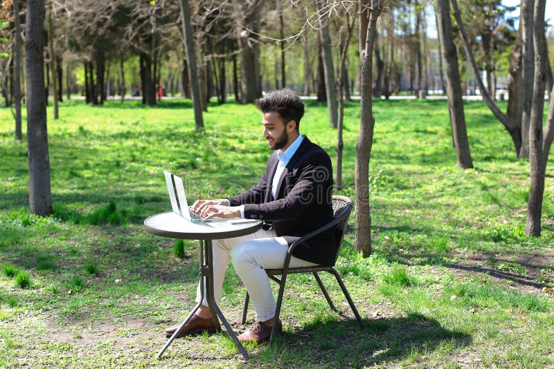 Journalist finished work in park stock image