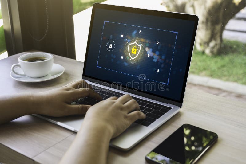 Person using a Laptop Computer with data protection, Cyber security, information safety and encryption concept stock photo
