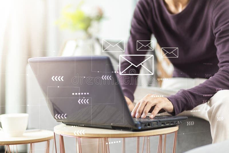 Person Using Laptop with Email Icon and Sending while Working at Home