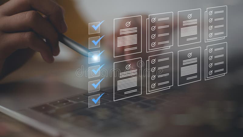 A person is using a laptop with a stylus to check off items on a list. The list appears to be a to-do list or a checklist, and the stock image
