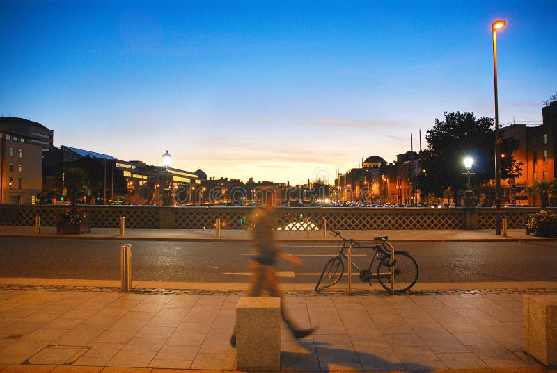 Person walking at sunset in Dublin royalty free stock photography Person walking at sunset in Dublin royalty free stock photography