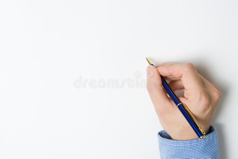 Person writing on paper stock photo