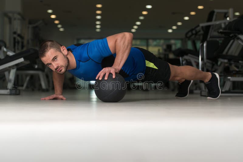 Personal Trainer Doing Pushups on Floor in Gym Stock Image Image of