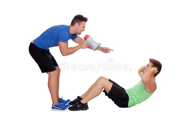 Personal trainer with a megaphone and boy making abdominal stock images