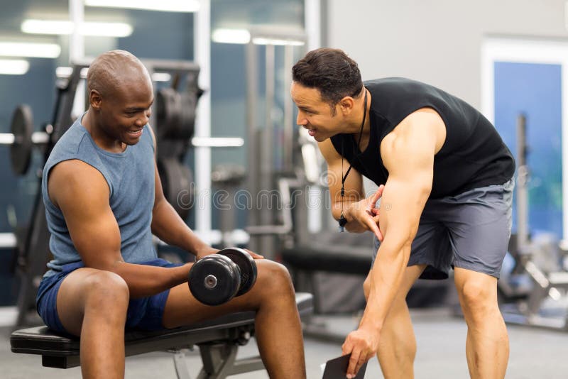 Gym Personal Trainer Man with Weight Training Stock Image Image of