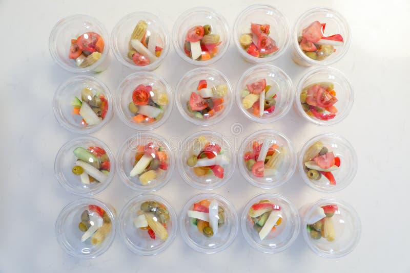 Personalized Vegetables in Plastic Cups. Safe Refreshments in the Days