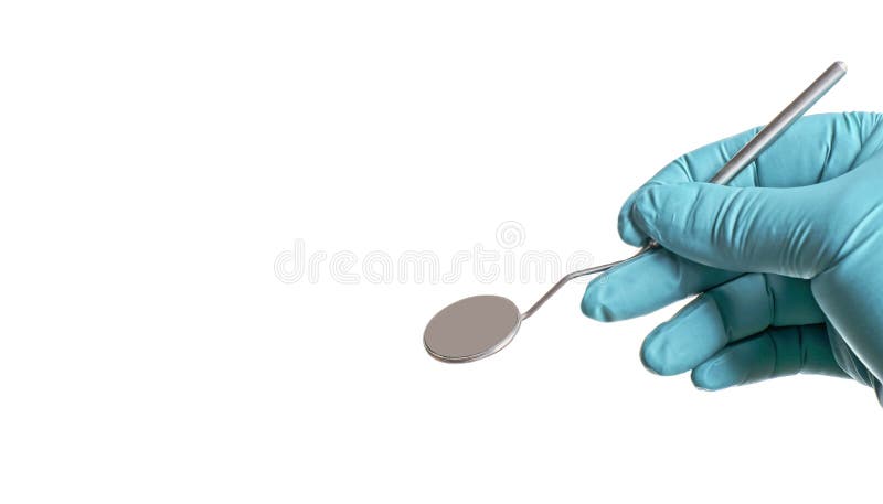 Personne méconnaissable avec le gant chirurgical tenant un miroir de bouche images stock Personne méconnaissable avec le gant chirurgical tenant un miroir de bouche images stock