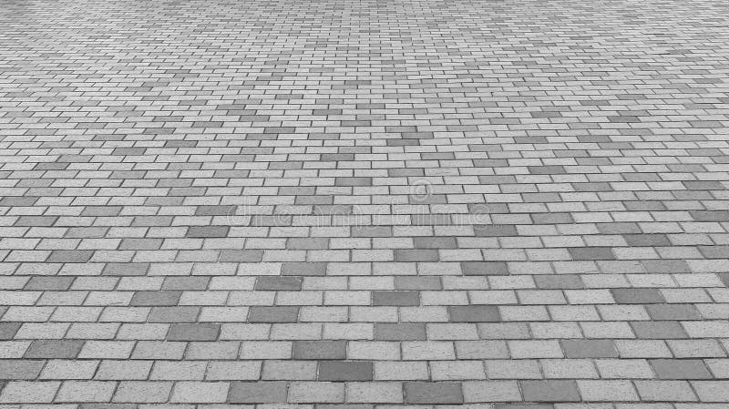 Perspectiefmening van Monotoon Gray Brick Stone Street Road Stoep, bestratingstextuur