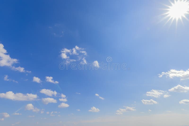 Perspective Blue Sky with Clouds and Sun on the Right Stock Photo