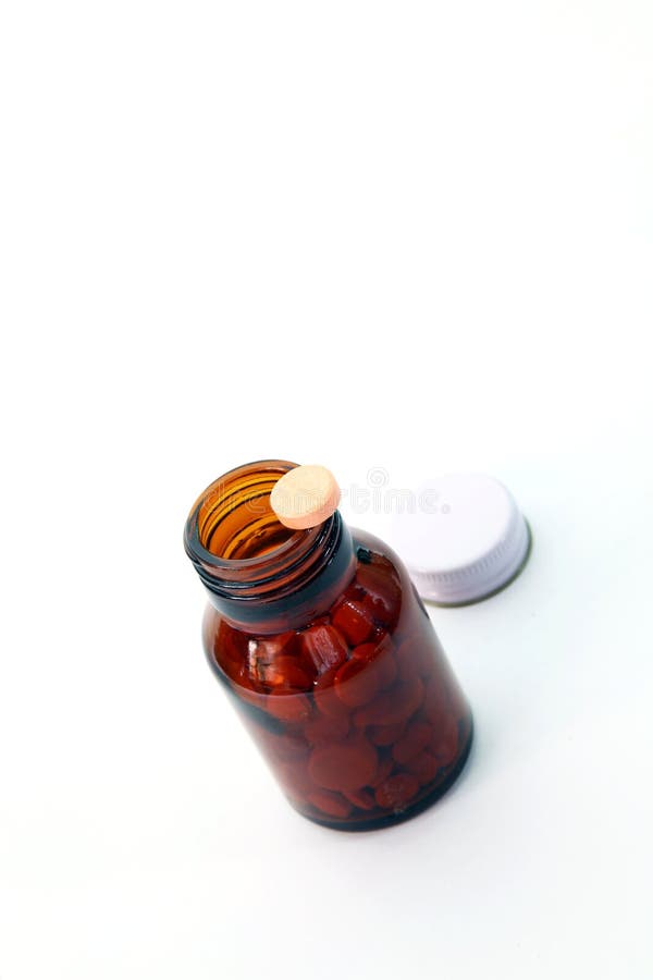 Perspective of pill on pill bottle