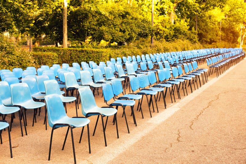 Perspective of Plastic Blue Chairs for an Event Stock Image Image of