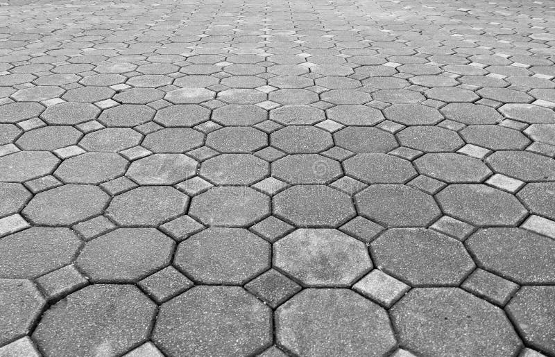 Perspective view of Grunge Gray Brick Stone on The Ground for Street Road. Sidewalk, Driveway, Pavers stock photography Perspective view of Grunge Gray Brick Stone on The Ground for Street Road. Sidewalk, Driveway, Pavers stock photography