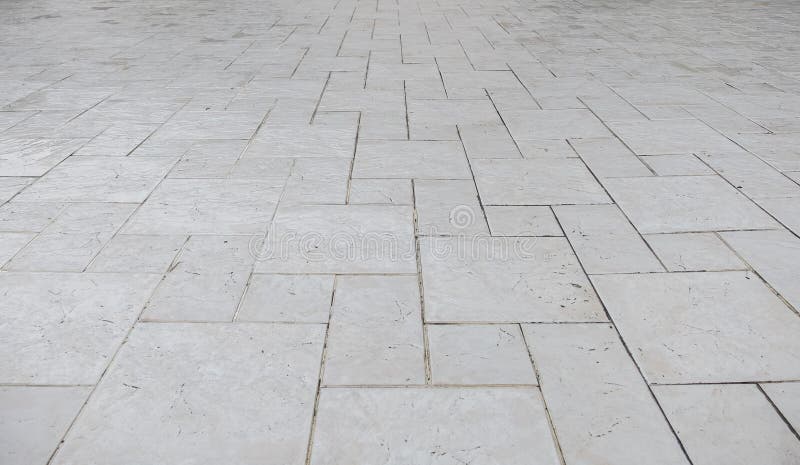 Perspective view of Grunge White Square Brick Stone on The Ground for Street Road. Sidewalk, Driveway, Pavers stock images Perspective view of Grunge White Square Brick Stone on The Ground for Street Road. Sidewalk, Driveway, Pavers stock images