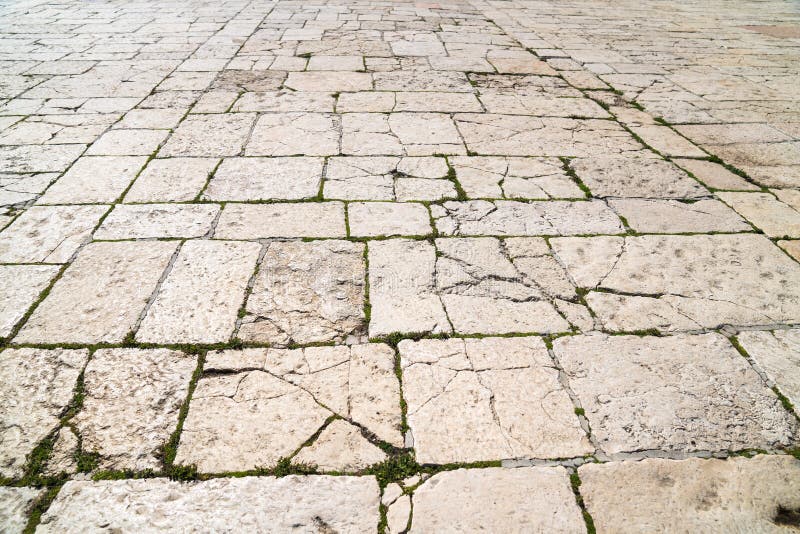 A perspective view of a old limestone brick. Sidewalk tile, the texture of the sidewalk on the Temple Mount in Jerusalem