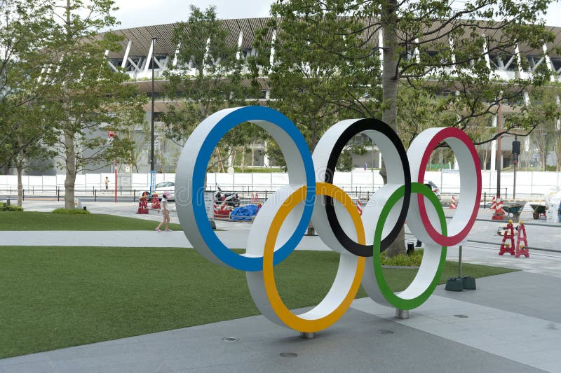 Perspective view of Olympic Rings. Background with New National Stadium, Tokyo