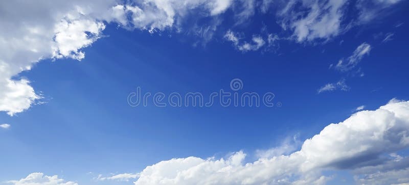 Perspective view of panoramic romantic dreamy fairy navy blue sky with white grey clouds. High resolution artistic skyline background image. Perspective view of panoramic romantic dreamy fairy navy blue sky with white grey clouds. High resolution artistic skyline background image