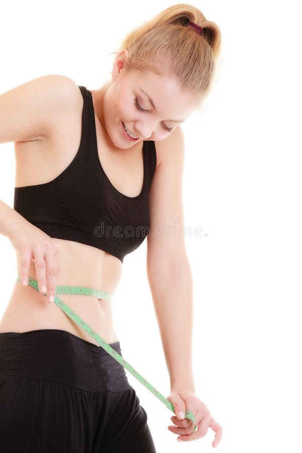Perte de poids. Bande de mesure verte sur le corps de femme photographie stock libre de droits Perte de poids. Bande de mesure verte sur le corps de femme photographie stock libre de droits