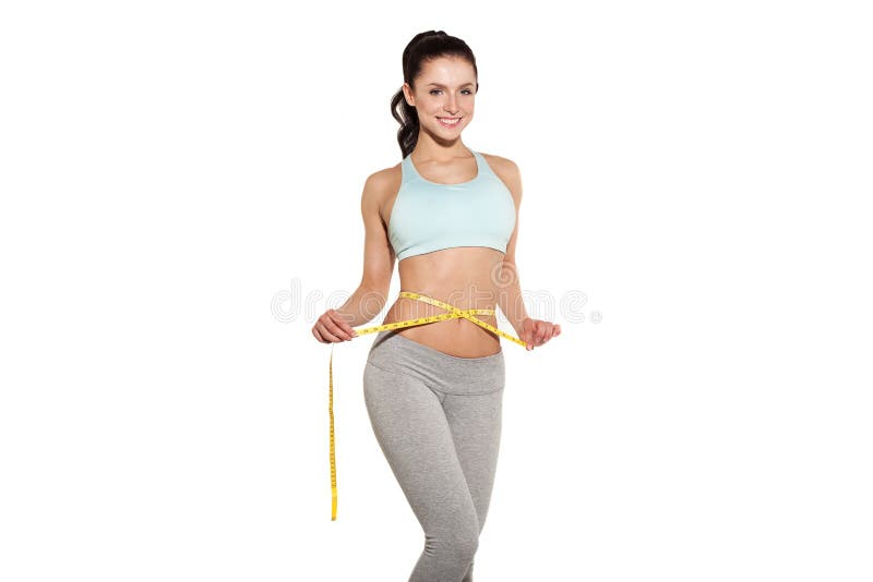 Perte de poids, fille de sports mesurant sa taille images stock Perte de poids, fille de sports mesurant sa taille images stock
