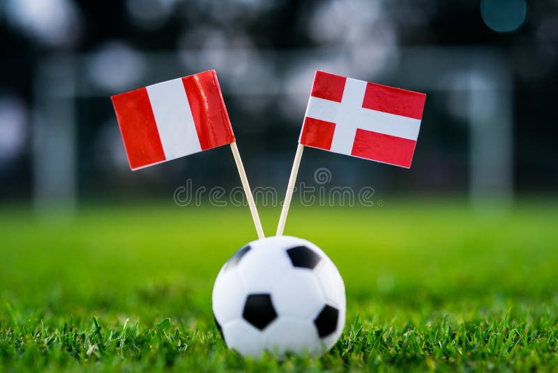 Peru - Denmark, Group C, Saturday, 16. June, Football, World Cup, Russia 2018, National Flags on green grass, white football ball royalty free stock images Peru - Denmark, Group C, Saturday, 16. June, Football, World Cup, Russia 2018, National Flags on green grass, white football ball royalty free stock images