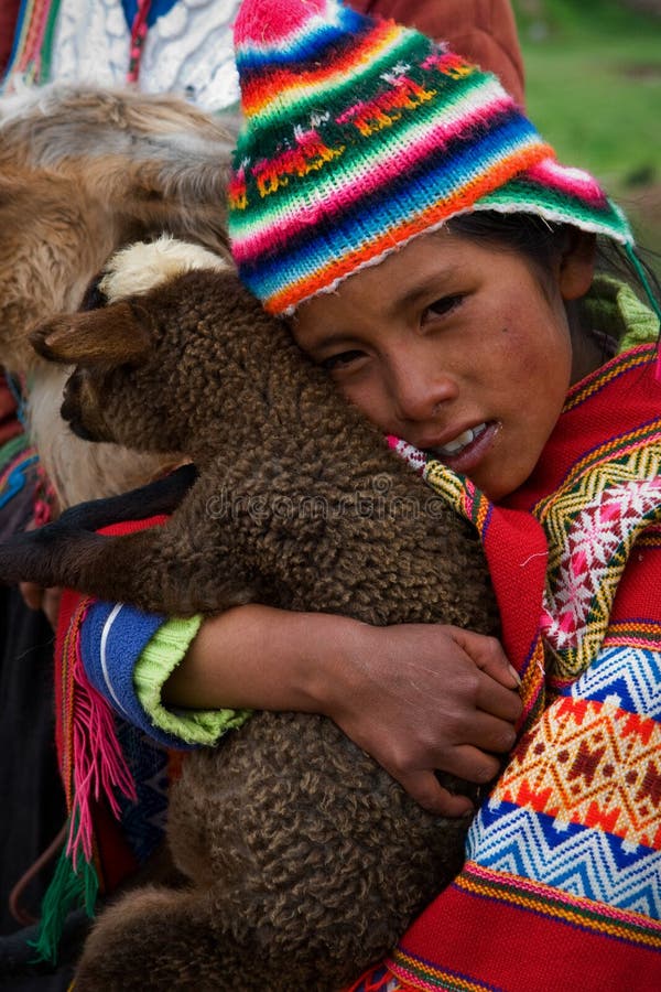 The Peruvian girl and the kid of the Lama. stock image The Peruvian girl and the kid of the Lama. stock image