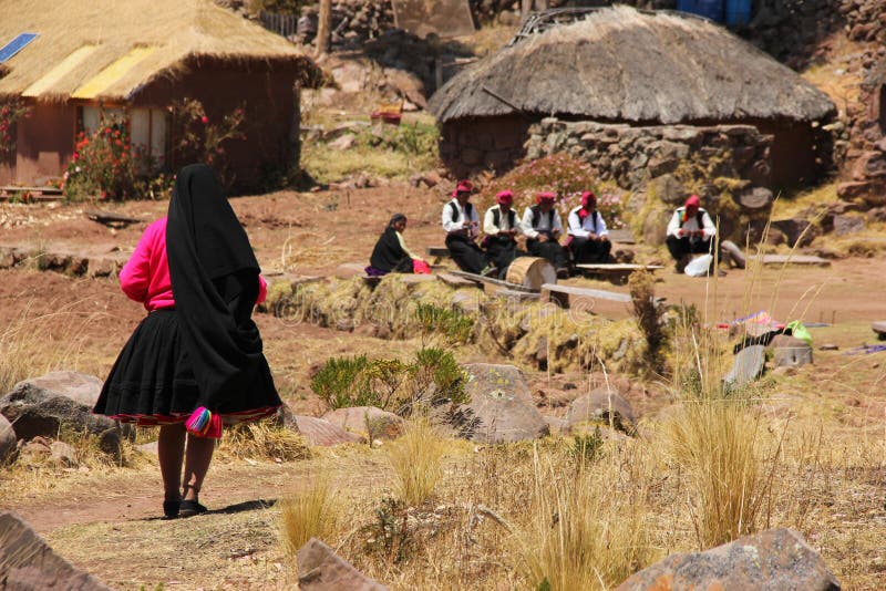 Peruvian Woman walking in a village stock image Peruvian Woman walking in a village stock image