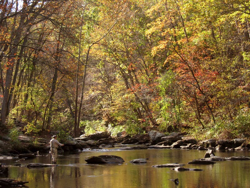 Photo of fly fishermen on the Gunpowder river during October. The Gunpowder is popular trout stream near Baltimore Maryland. Photo of fly fishermen on the Gunpowder river during October. The Gunpowder is popular trout stream near Baltimore Maryland.