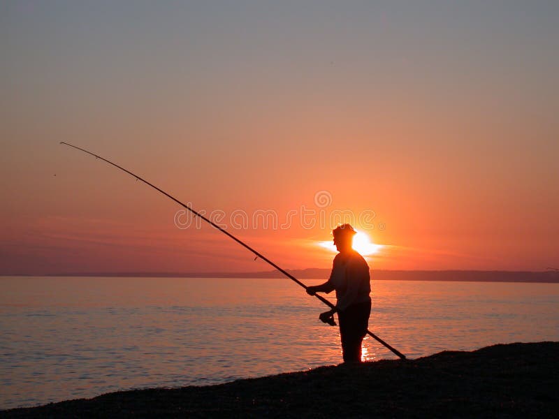 Pesca marittima al crepuscolo immagini stock libere da diritti Pesca marittima al crepuscolo immagini stock libere da diritti