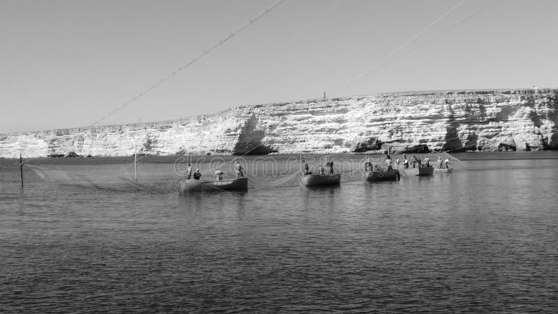 Fishermen fishing with nets in the sea in Crimea. Fishermen fishing with nets in the sea in Crimea