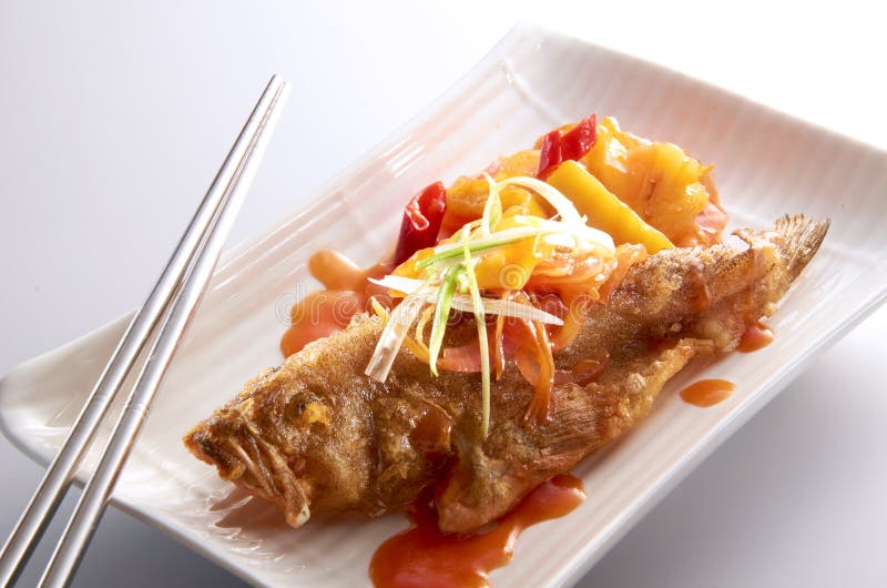 Fish cook with sweet and sour sauce. Fish cook with sweet and sour sauce