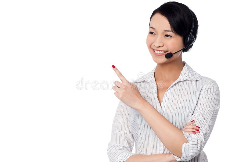 Pessoal de apoio ao cliente que aponta afastado imagem de stock Pessoal de apoio ao cliente que aponta afastado imagem de stock