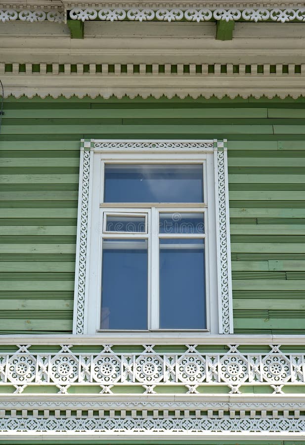 PETERHOF, RUSSIA. Wooden carved platband and decor of a facade of the building of the former estate of I.A. Khrushchev 1870-1889 stock photos PETERHOF, RUSSIA. Wooden carved platband and decor of a facade of the building of the former estate of I.A. Khrushchev 1870-1889 stock photos