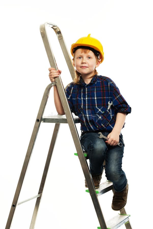 Enfant Garçon Tord Le Boulon Avec Un Tournevis Enfant Réparateur Avec Outil  De Réparation Enfant En Casque Et Combinaison Sur Chantier Petit Ingénieur  Ouvrier